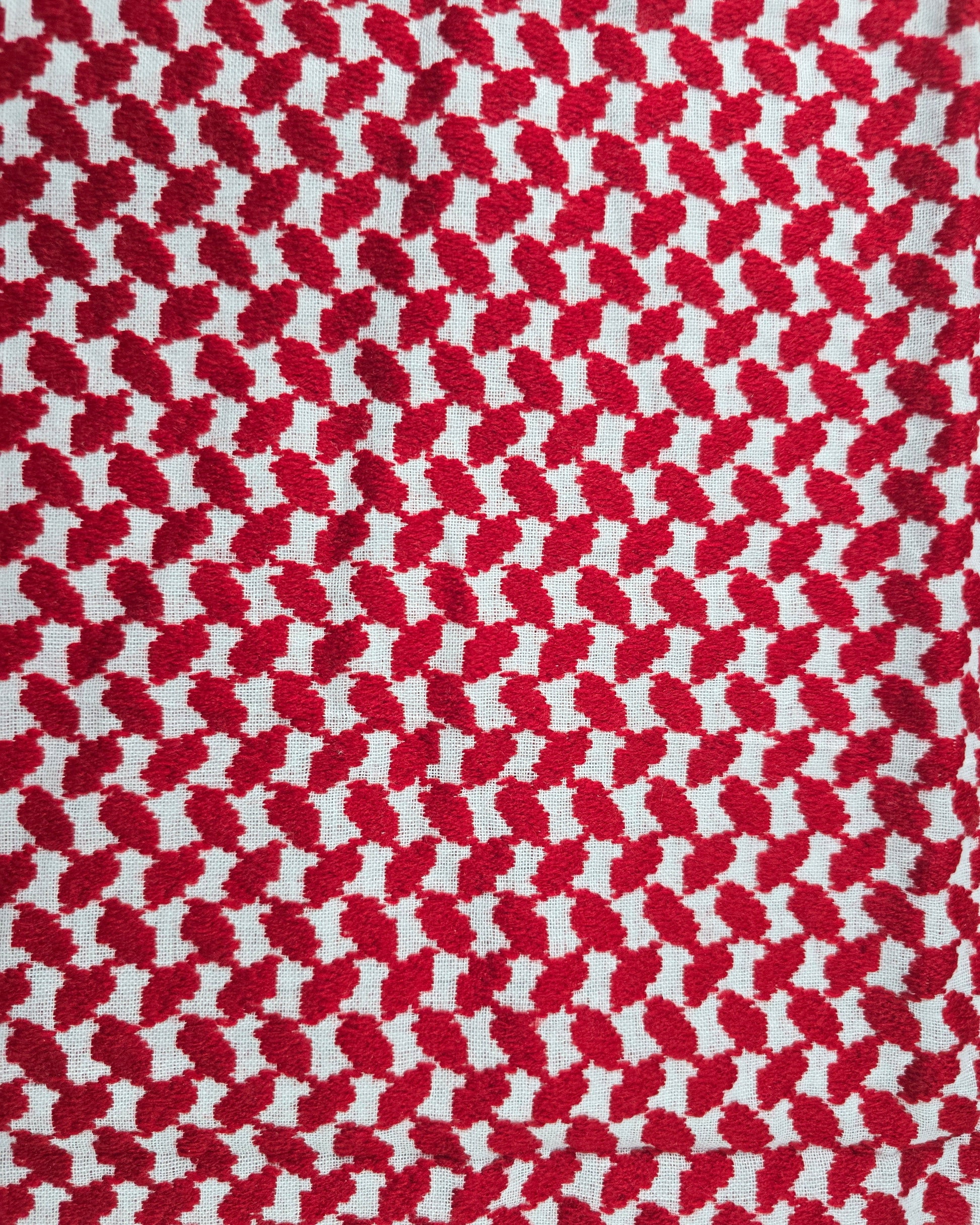 Red and white houndstooth pattern fabric texture