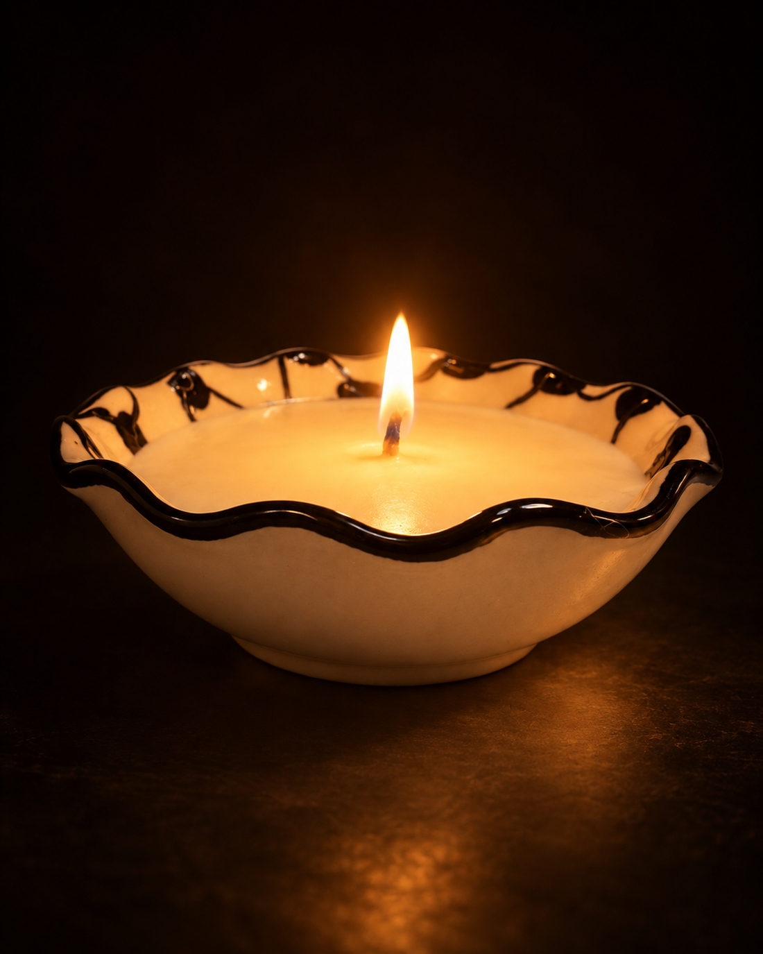 Candle in hand-painted keffiyeh ceramic bowl from Hebron, wax poured by Sondos Shureim in Nablus