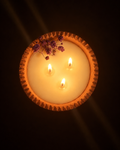 Candle in pottery bowl, hand-poured by Sondos Shureim in Nablus, Palestine